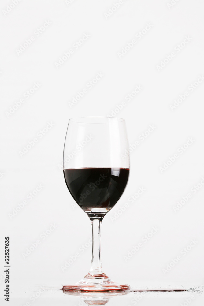Red wine in wineglass isolated on white background .. Red wine in wineglass isolated on white background ..