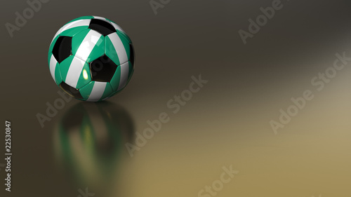 Fototapeta Naklejka Na Ścianę i Meble -  Glossy Nigeria soccer ball on golden metal surface