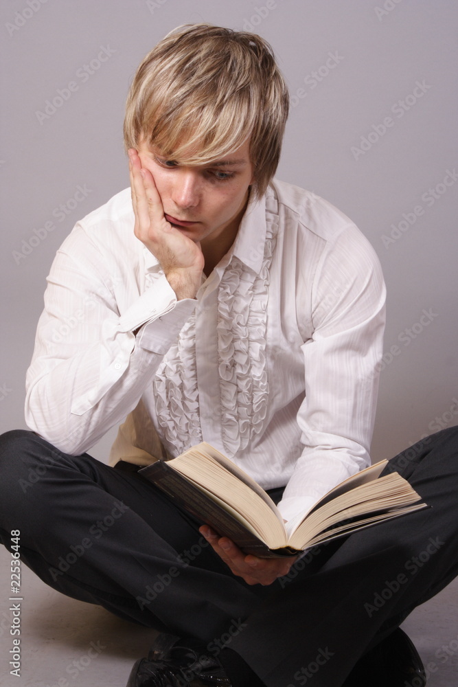 young man with books, reading and studying young man with books, reading and studying
