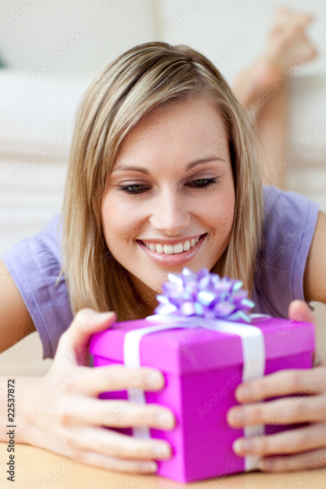 Jolly woman holding a gift