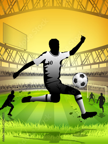 Soccer player kicking a ball on the field of a stadium photo