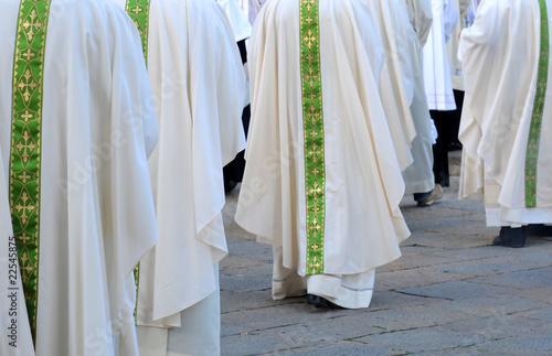 Row of male religious going to church