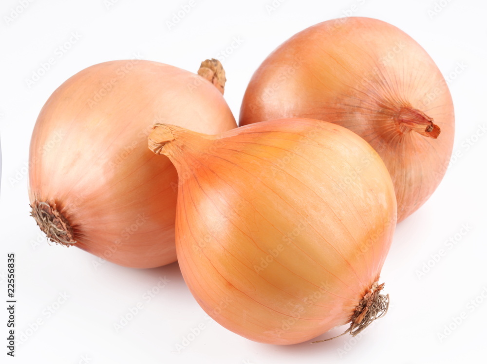 Fresh bulbs of onion on a white background Fresh bulbs of onion on a white background