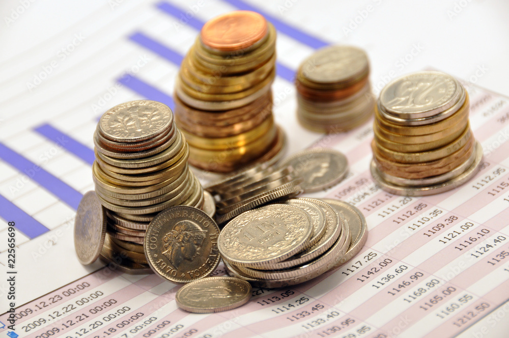 Pile of coins on a market report Pile of coins on a market report