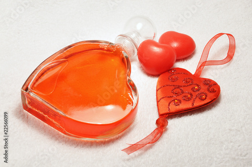 Bathfoam and soap hearts on a towel photo