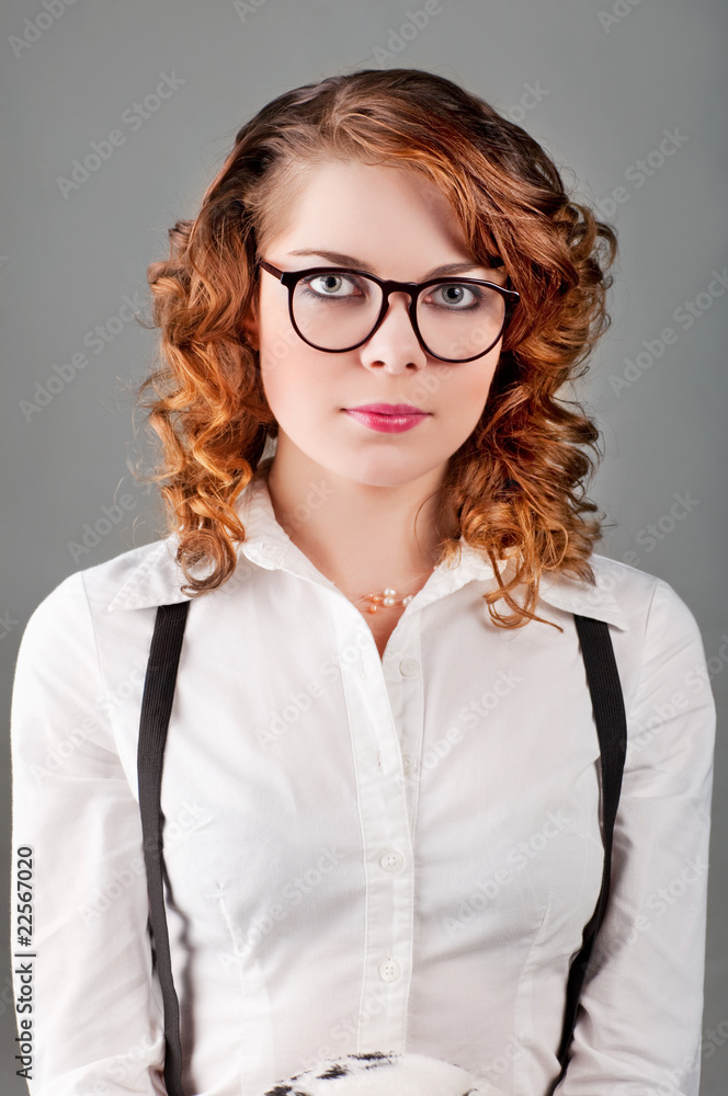 Portrait of a pretty young woman in glasses. Portrait of a pretty young woman in glasses.