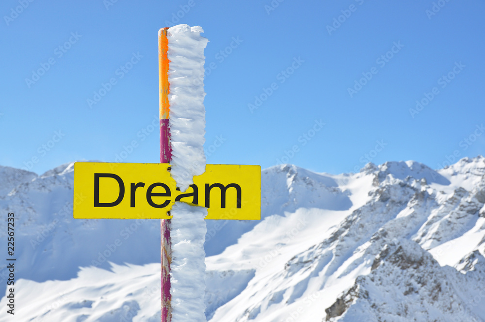 DREAM sign against mountain scenery
