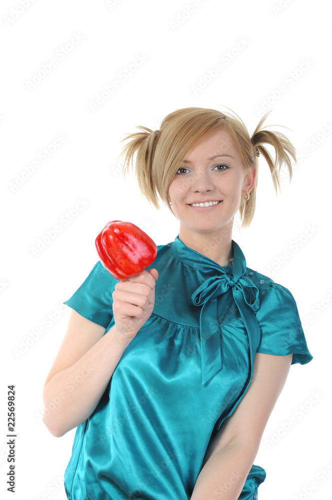 Young smiling girl holding a red pepper. Young smiling girl holding a red pepper.