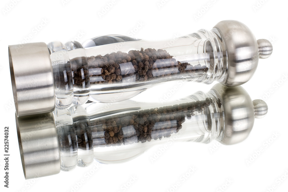 glass grinder of pepper isolated on a white background glass grinder of pepper isolated on a white background