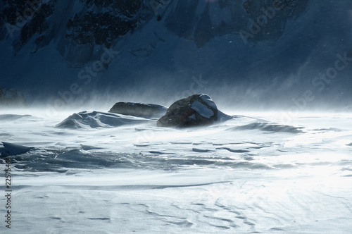 Stone on a glacier under fury of wind and sun.