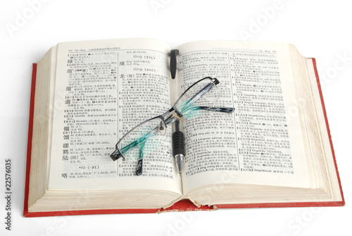 dictionary & pen with glasses