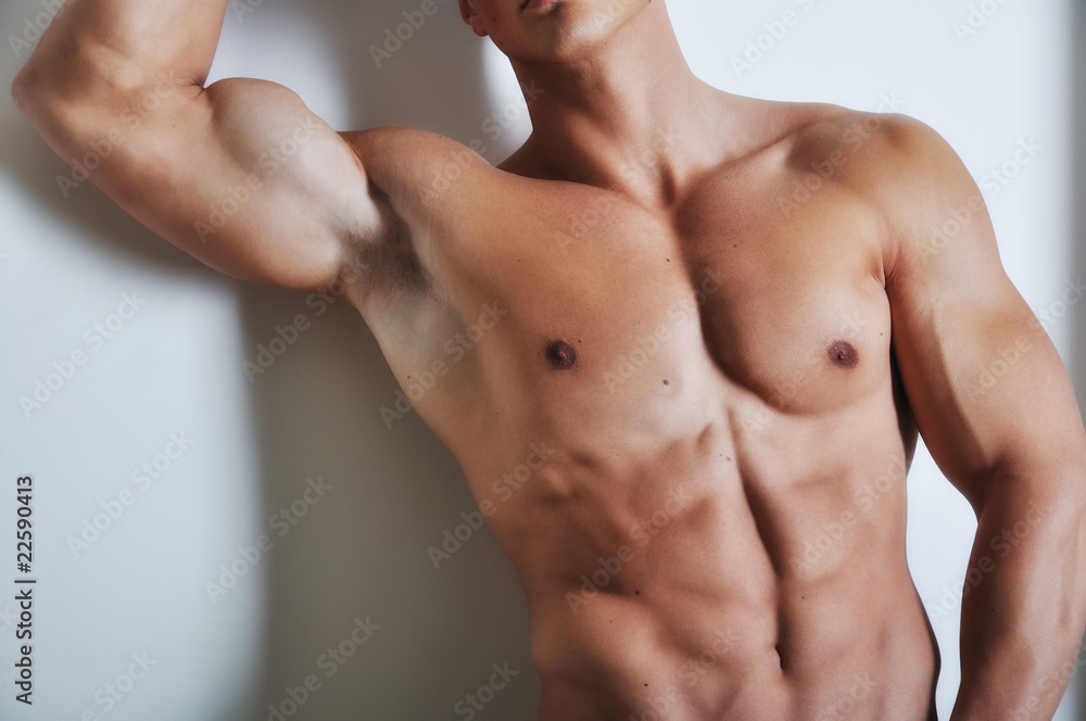 Fototapeta premium Athletic man with six-pack abs