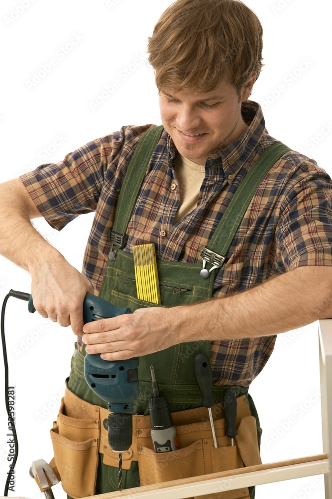 Happy young man drilling Happy young man drilling