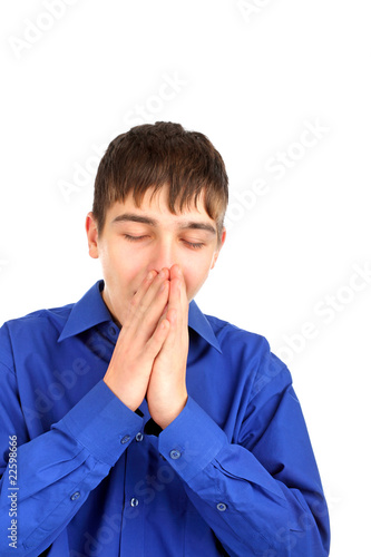 The yawning teenager isolated on the white photo