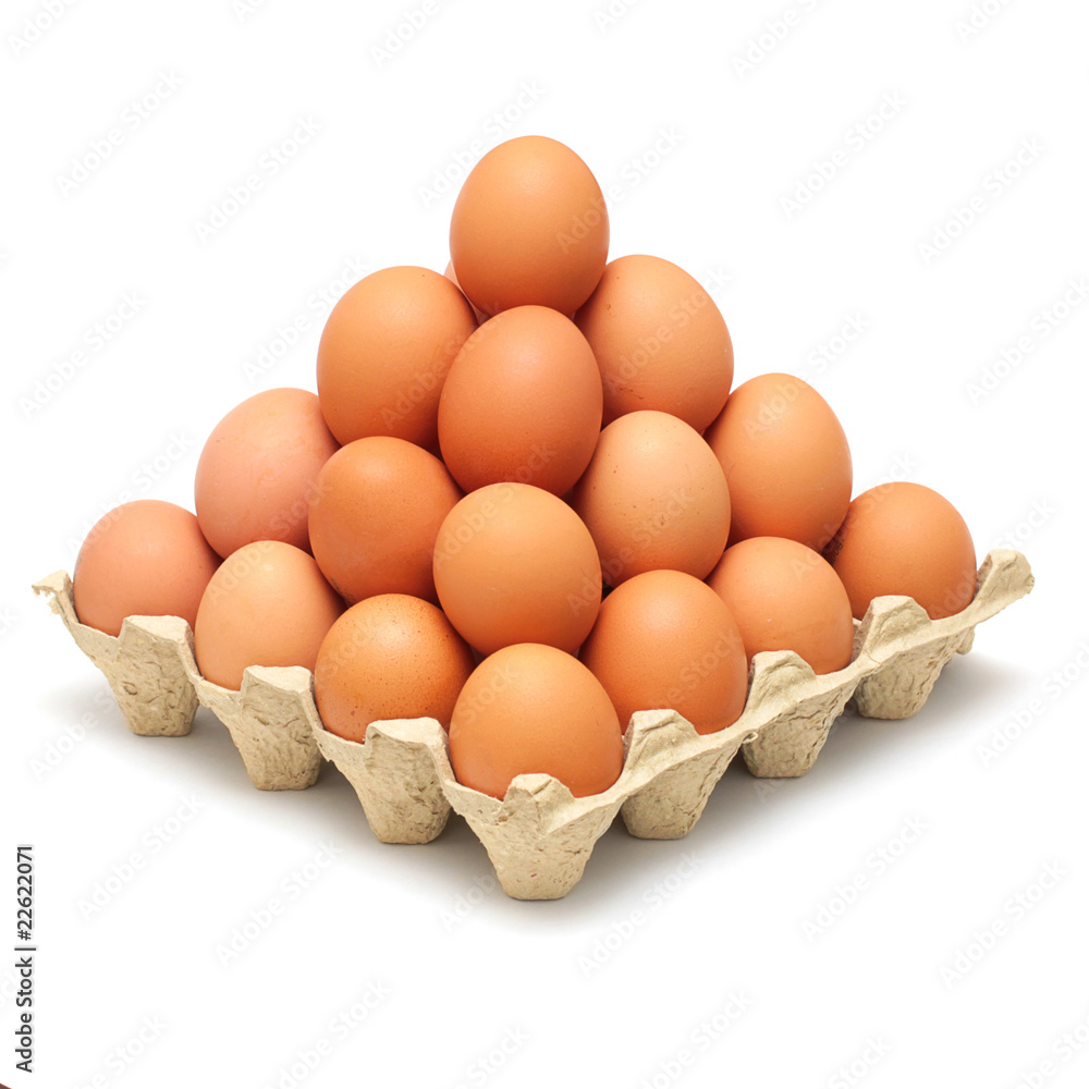pyramid of brown eggs isolated on white background pyramid of brown eggs isolated on white background