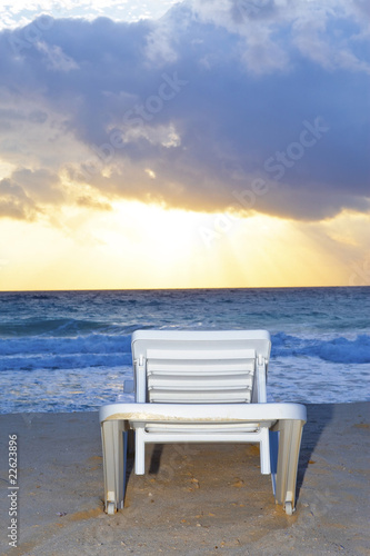 Empty chaise lounge before ocean © Konstantin Kulikov