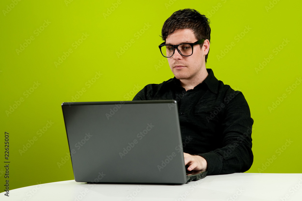 Geek in black shirt working on computer
