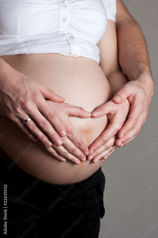 Advanced pregnant belly with hands Advanced pregnant belly with hands