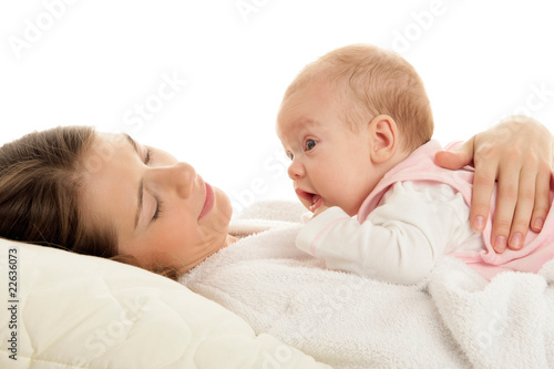 Mother bedding with child on chest