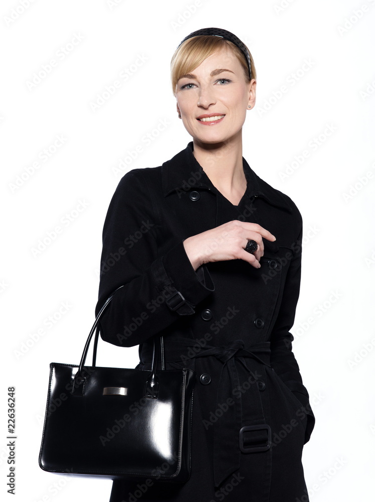 beautiful blond caucasian .woman with black overcoat and purse beautiful blond caucasian .woman with black overcoat and purse