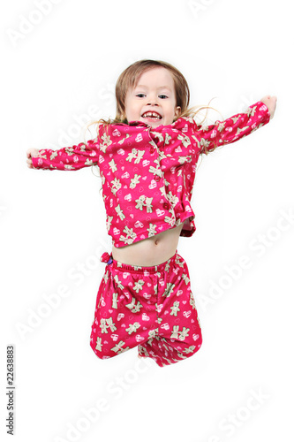 Little girl jumping on isolated white background photo