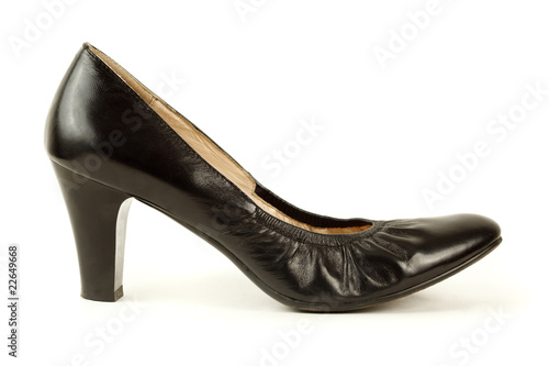 Black women's high-heeled shoes. Isolated on white. Side view.
