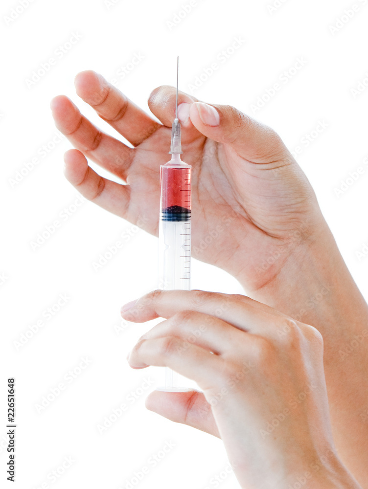 Close-up of a syringe ready for use Close-up of a syringe ready for use