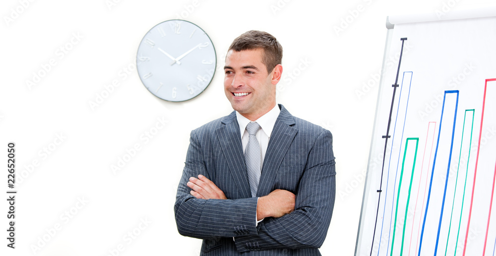Young businessman with folded arms doing a presentation Young businessman with folded arms doing a presentation