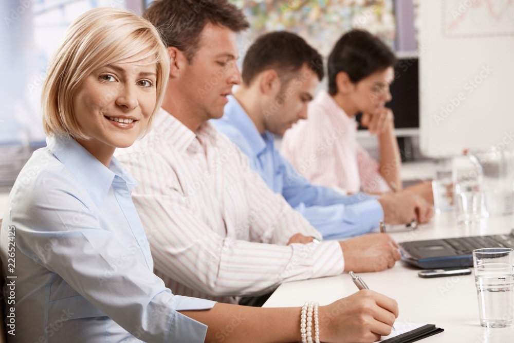 Happy businesswoman in business meeting