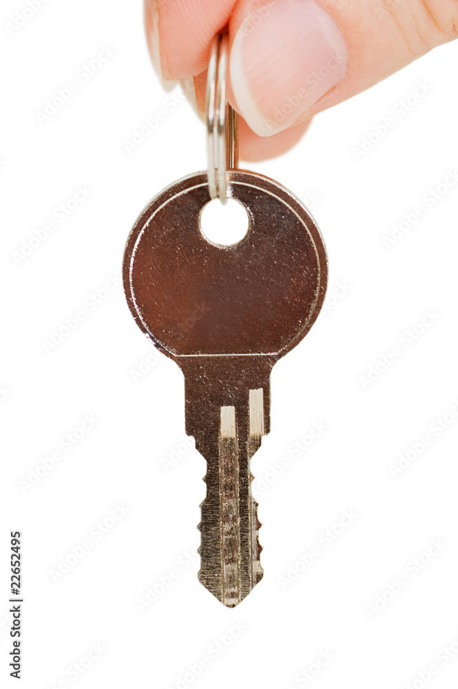 Key in a hand isolated on white background Key in a hand isolated on white background