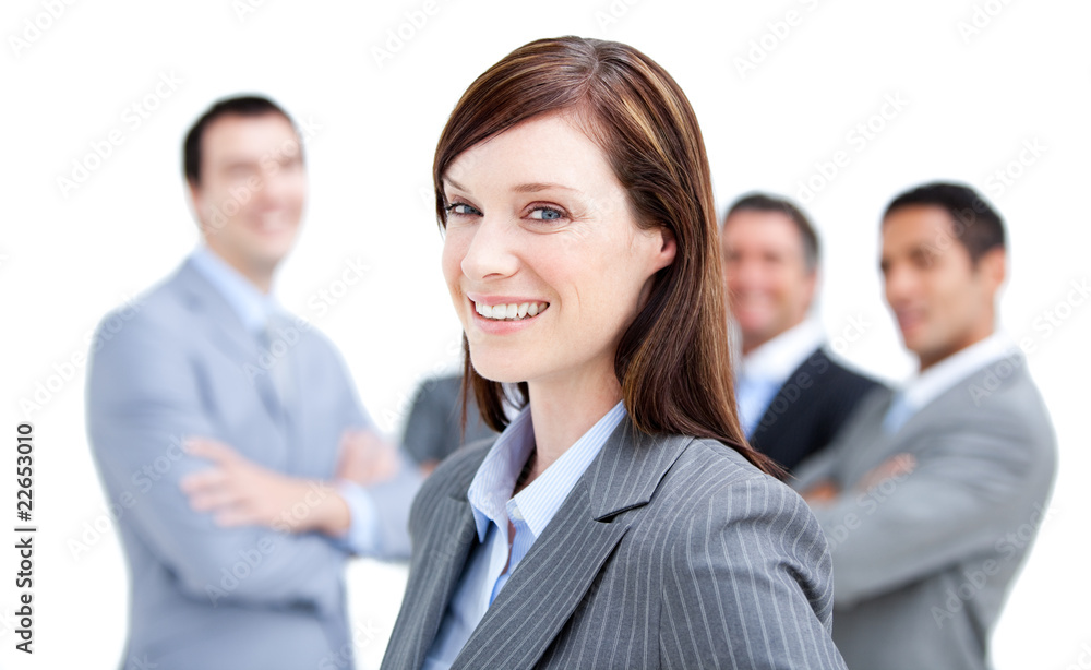 Self-assured businesswoman standing with her team Self-assured businesswoman standing with her team