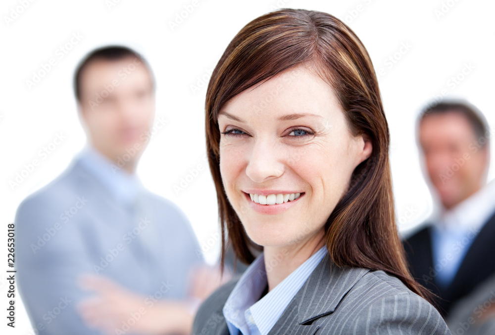 Confident businesswoman standing with her team Confident businesswoman standing with her team