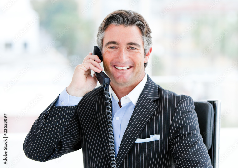 Self-assured mature businessman talking on phone Self-assured mature businessman talking on phone