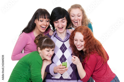 cheerful friends looking at cellphone