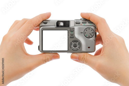 Photo camera in hands