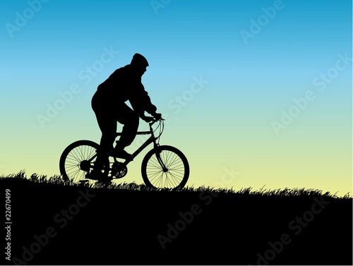 Mountain biking.Young boy rides a bicycle trought nature.