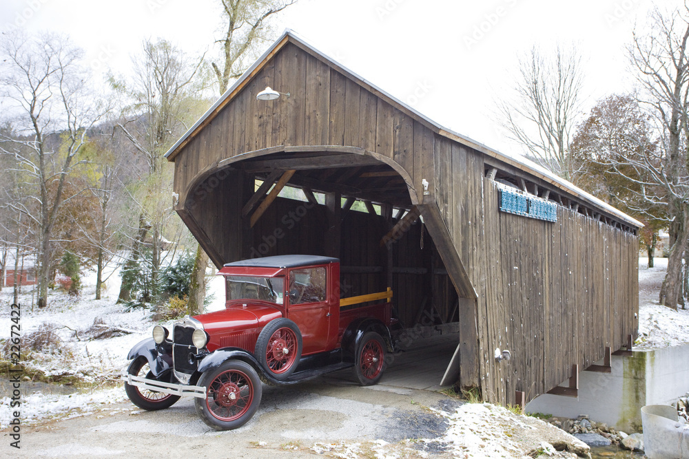 covered wooden bridge with old car, Vermont, USA