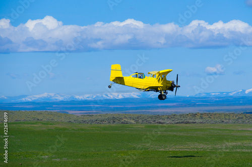 Agricultural aircraft spraying fertilizer