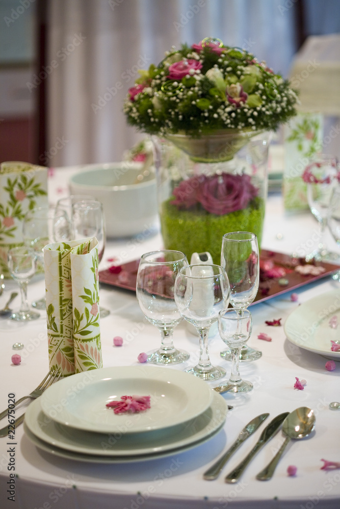 elegant dinner table with flowers and glass