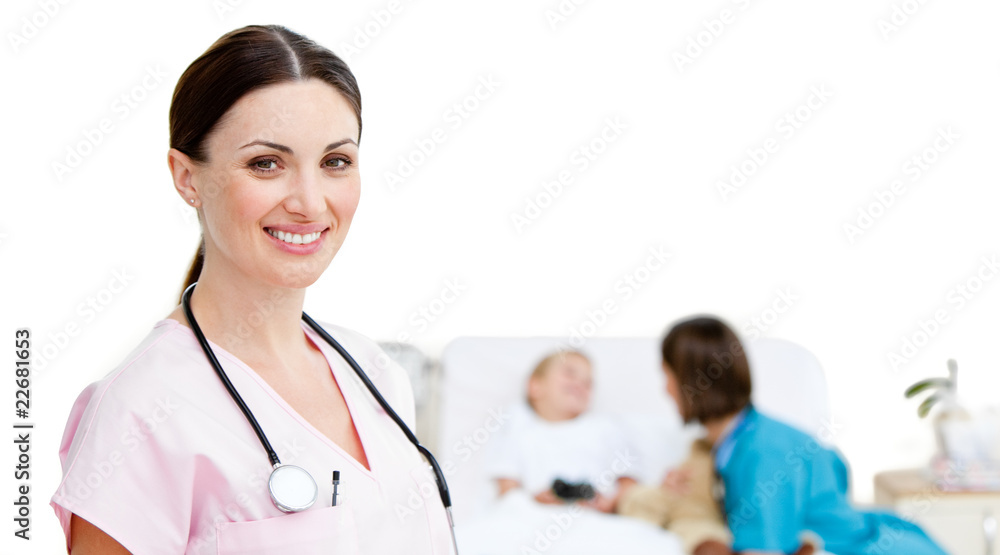 Portrait of smiling female doctor located in a patient room Portrait of smiling female doctor located in a patient room