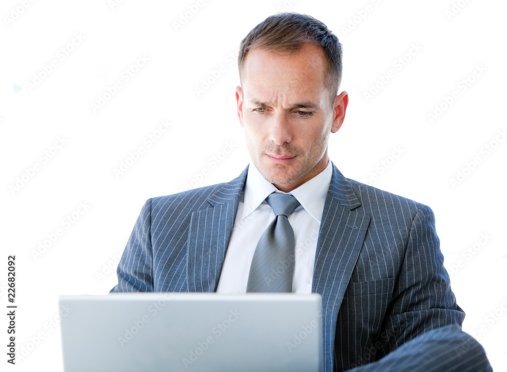 Handsome businessman using his laptop Handsome businessman using his laptop