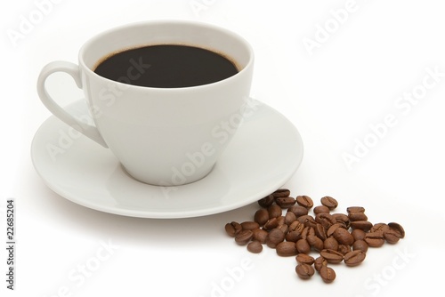 cup off coffee with coffee beans isolated on white
