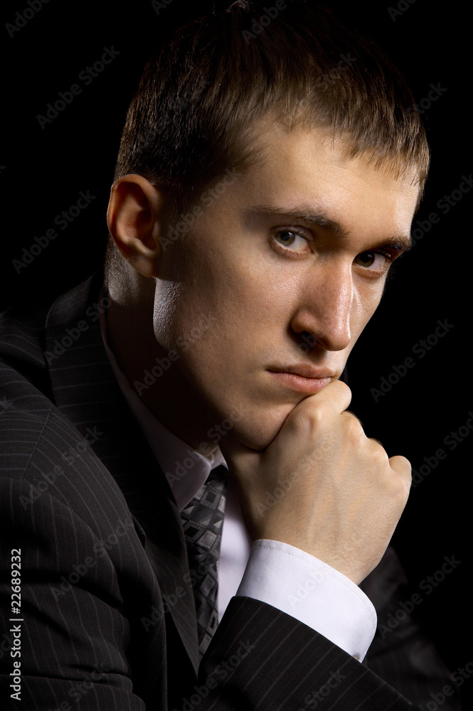 man in suit on black man in suit on black