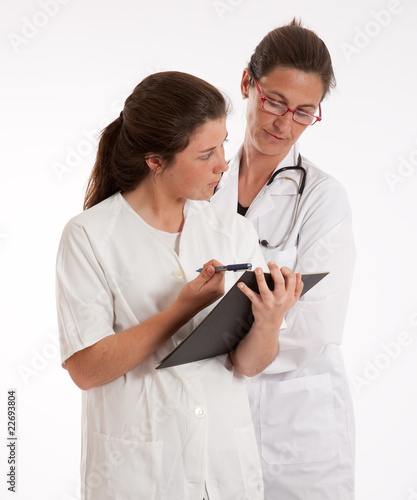 Doctor and nurse looking to...
