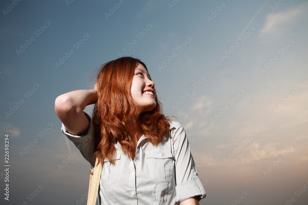 Beautiful young woman on the beach at sunset . Beautiful young woman on the beach at sunset .