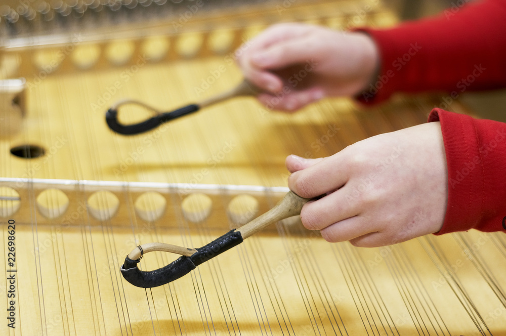 hammered dulcimer stringed musical instrument with player Stock Photo