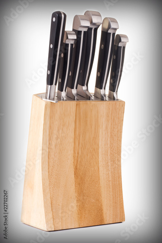 Set of kitchen knifes isolated on gradient background photo