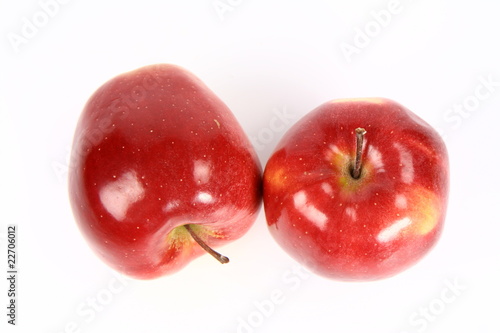 Two red and apples on white background