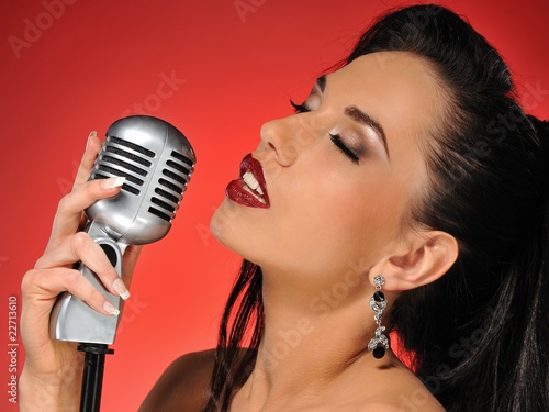 Beautiful brunette woman singing