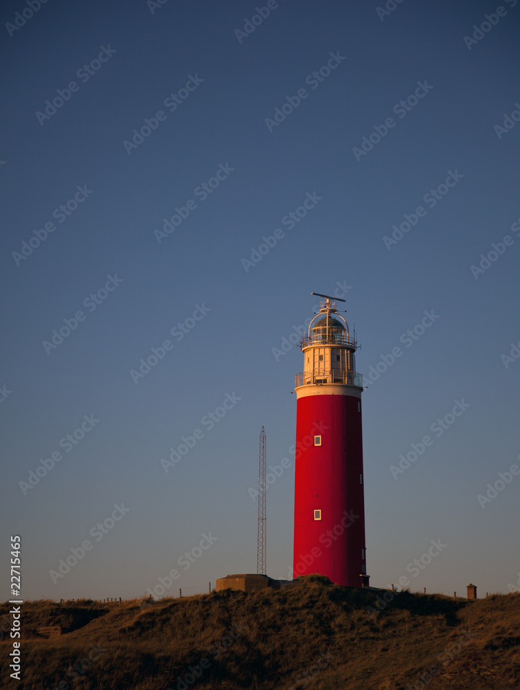 the lighthouse of texel in the evening light